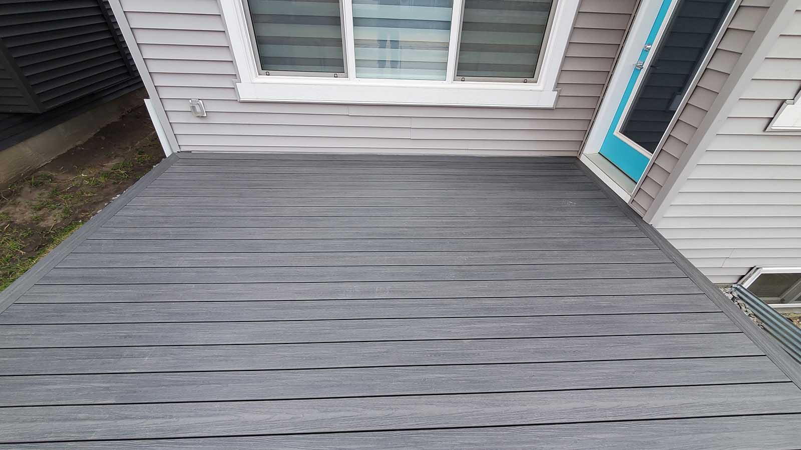 Grey composite deck surface with clean board lines built by Crestfield Decking in Edmonton, Alberta